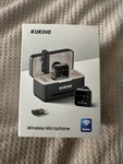 Kukiho Wireless Lavalier Microphone Iphone Ipad Android W/charging Case. Fixed Price $23.95.
