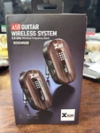 Xvive A58 - 5.8GHZ Wireless Guitar System Wcase Rosewood. Fixed Price $125.00.