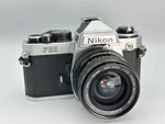 Nikon FE2 Silver Film Camera W Sigma 28MM Ai Lens-cla & Seals. Fixed Price $399.00.