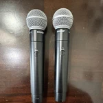 Shure Wireless Microphone System 2 Handheld Mics Transmitters Receiver Adapter. Fixed Price $500.00.